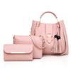 Pink handbag with matching pouch on a white background